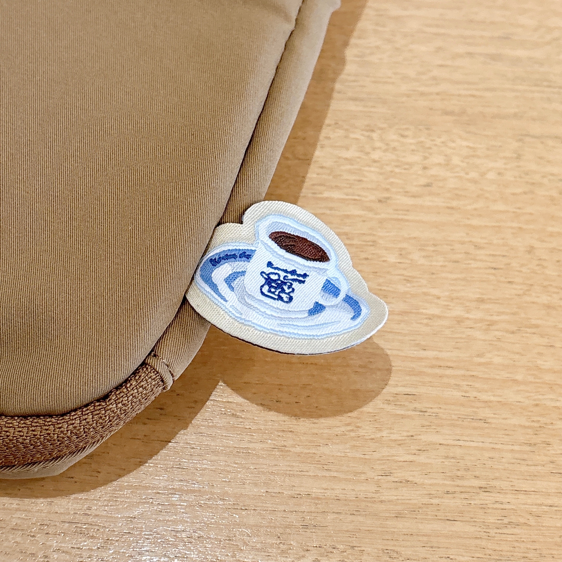 コメダ珈琲店の「【コメクション限定】コーヒー染めノートパソコンケース」