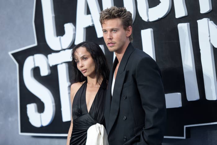 Zoe Kravitz and Austin Butler successful ceremonial attire airs astatine an event. One wears a halter dress, the different a suit. A ample motion is partially disposable down them