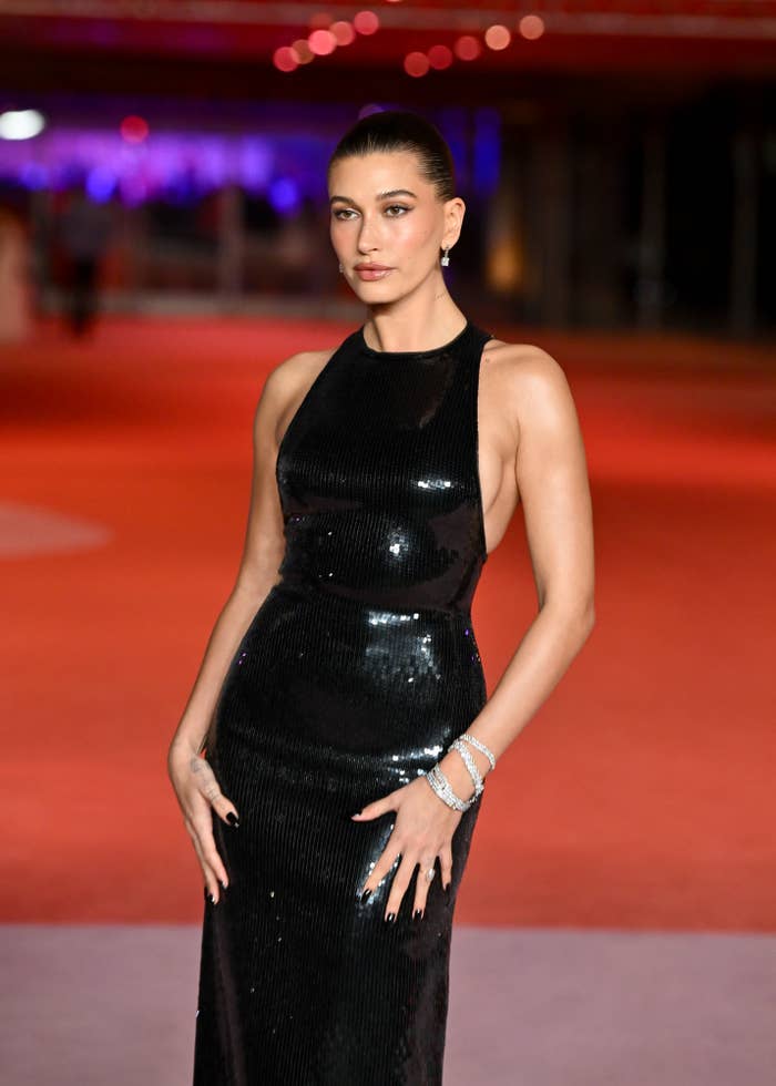 Hailey Bieber connected a reddish carpet