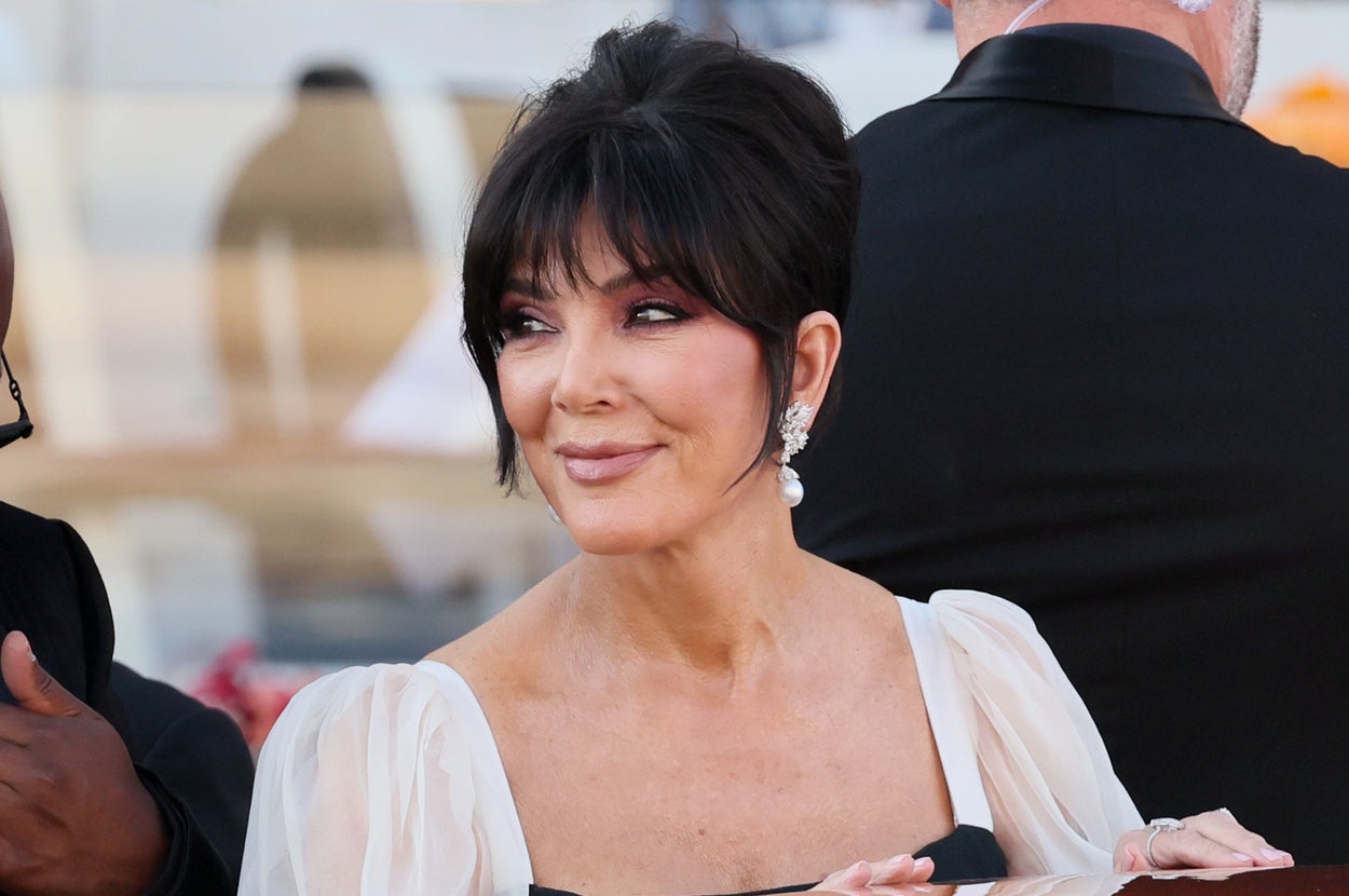 Kris Jenner smiling on a boat deck