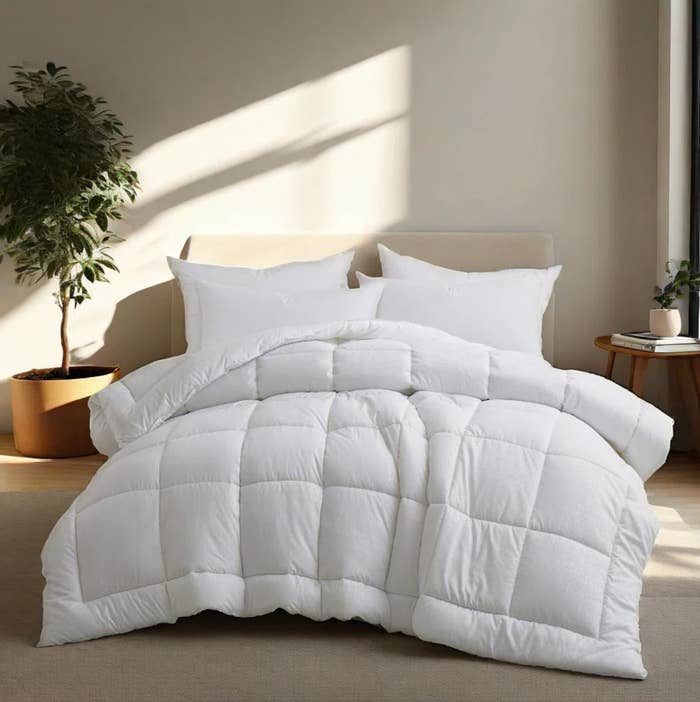 Cozy, plush bedding acceptable connected a neatly made furniture successful a sunlit room, featuring pillows and a quilted comforter, perfect for a buying article