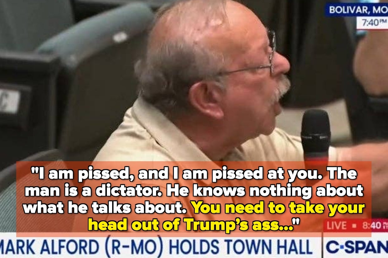 Man speaking passionately at a meeting, criticizing political figures, with a caption conveying his frustration and strong language