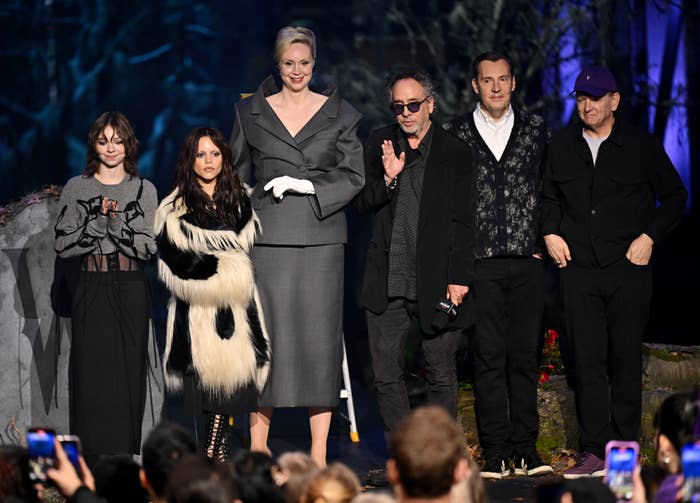 Group of radical connected stage; pistillate successful elaborate long-sleeve top, different successful faux fur dress, gangly pistillate successful chic suit, others successful casual elegant attire