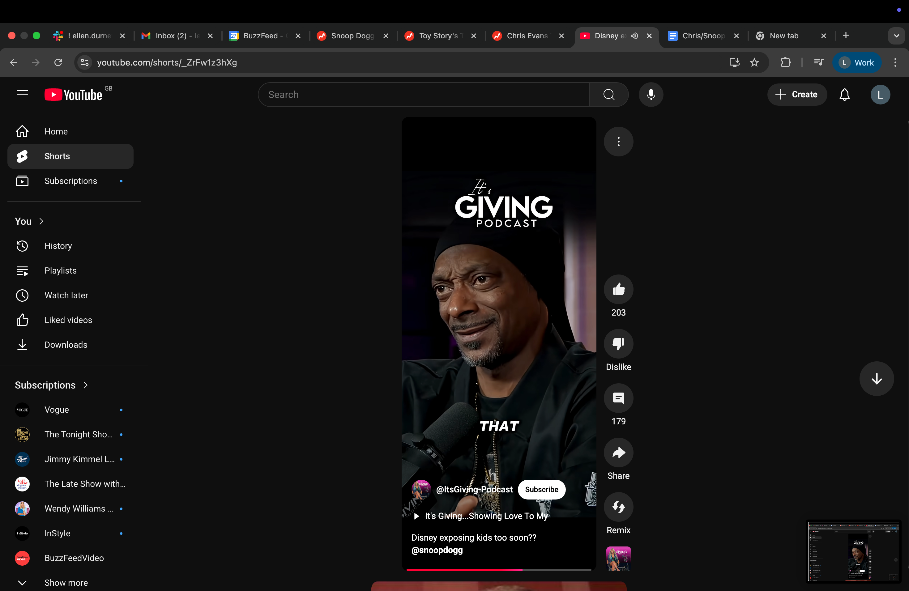 Snoop Dogg speaking into a microphone