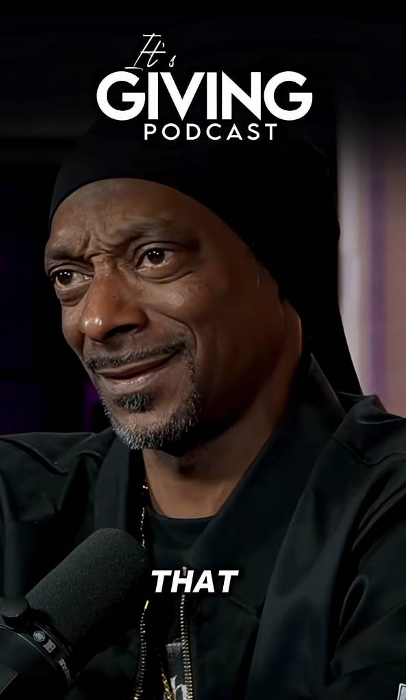 Snoop Dogg speaking into a microphone
