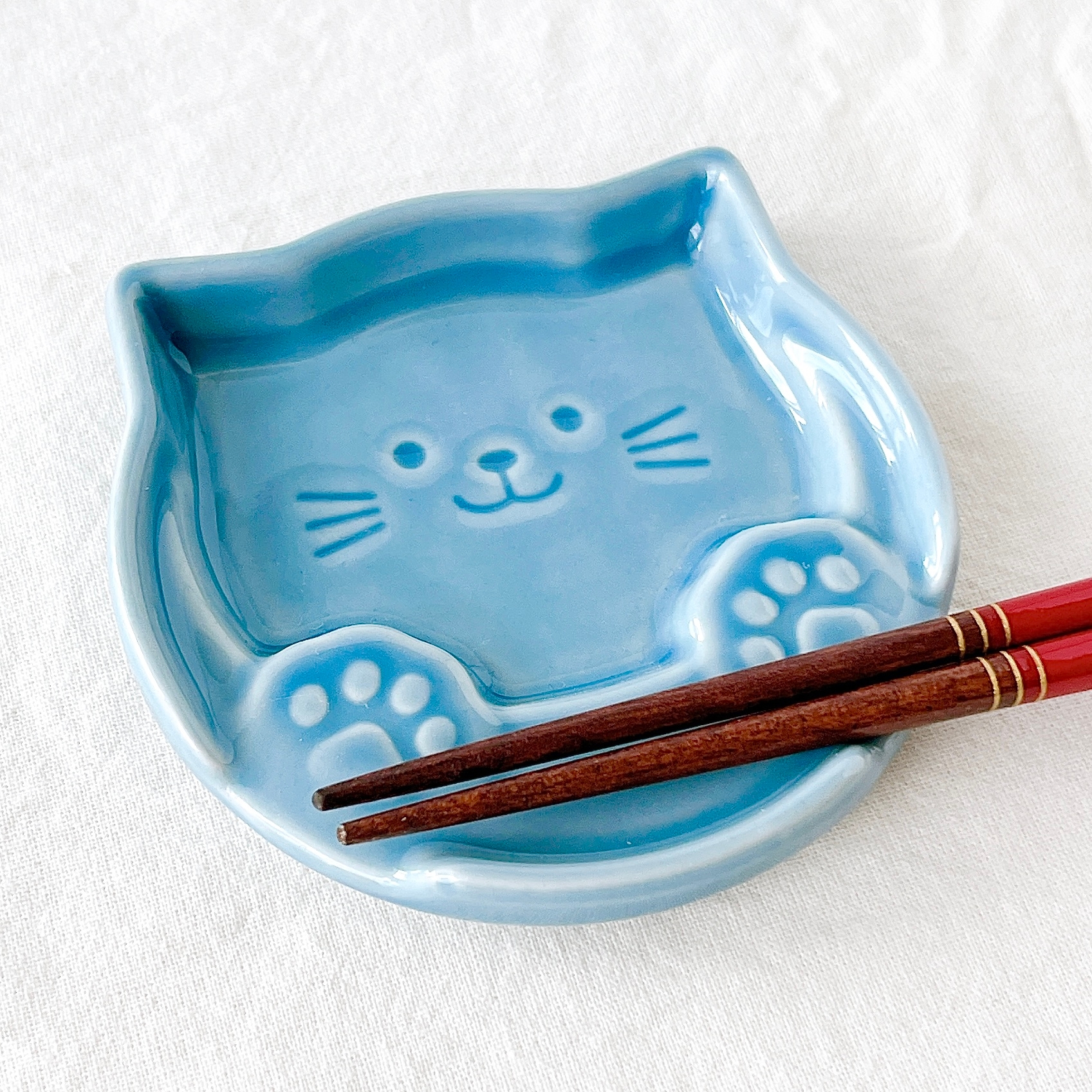 Seria(セリア)の「箸置きプレート 肉球ねこ」