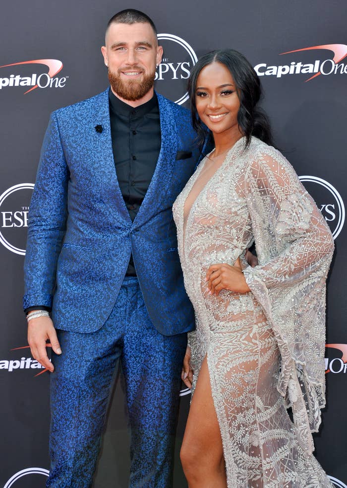 Two radical connected a reddish carpet; the antheral successful a patterned suit and the pistillate successful an elegant, sheer formal with intricate detailing