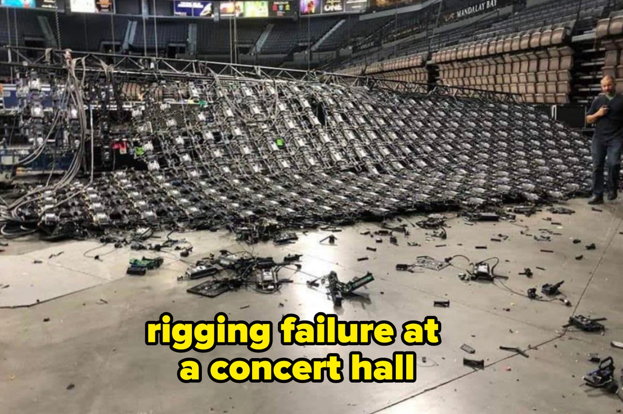 Collapsed stage screen structure inside an arena with scattered electronic debris