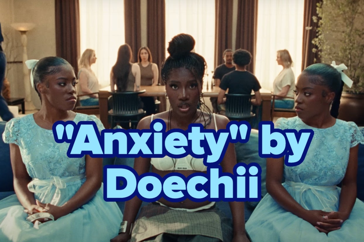 Three women sitting in a room; central figure, Doechii, looks intense, flanked by women in blue dresses. Text overlay: "Anxiety" by Doechii