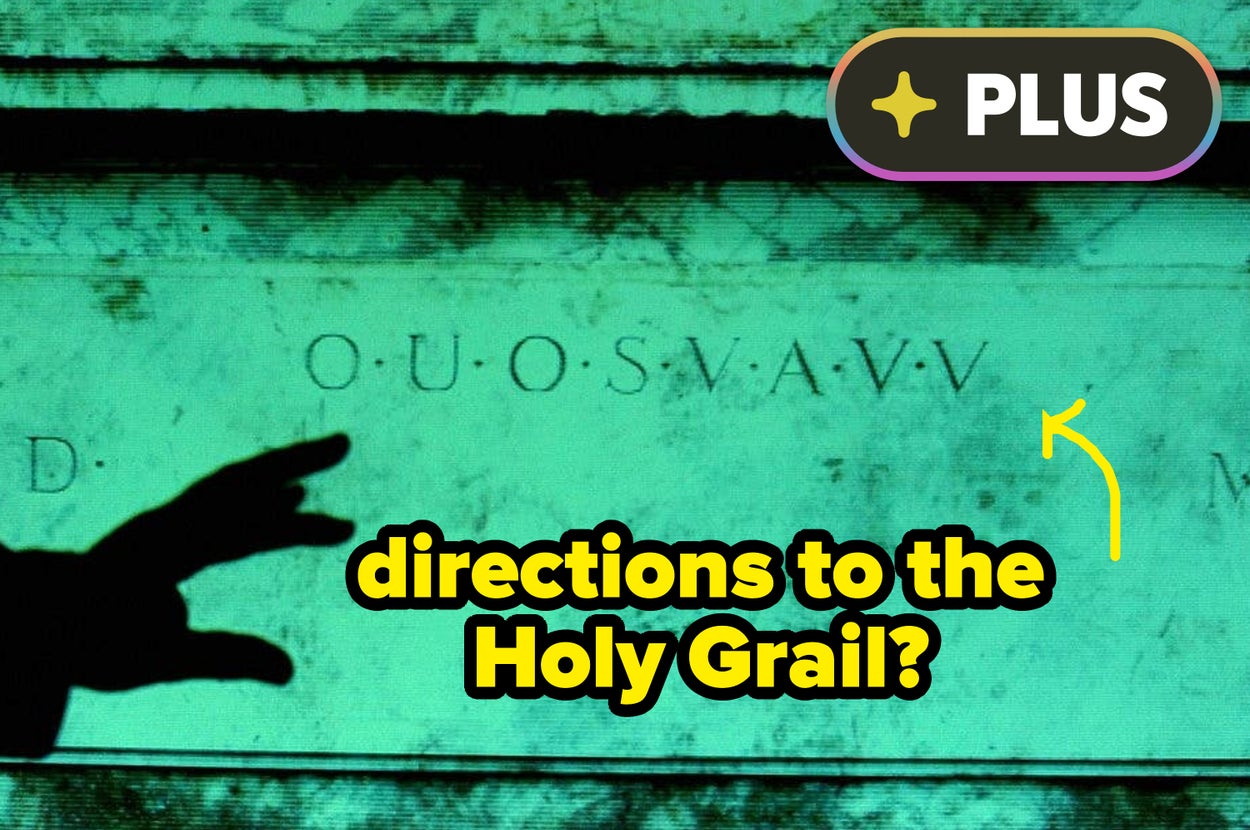 A finger points to ancient markings on a stone, with text overlay asking if it contains directions to the Holy Grail