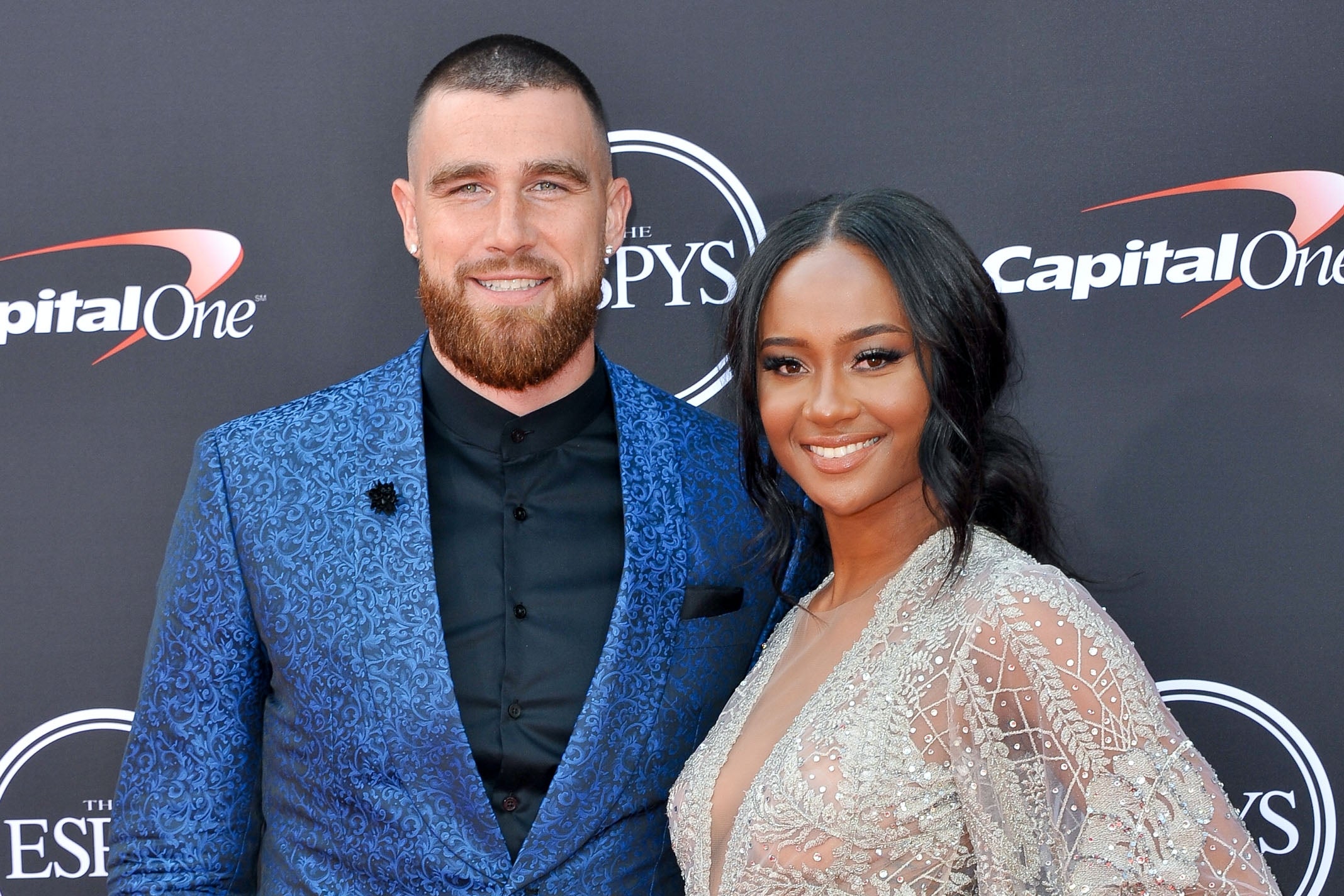 Travis Kelce and Kayla Nicole on a red carpet