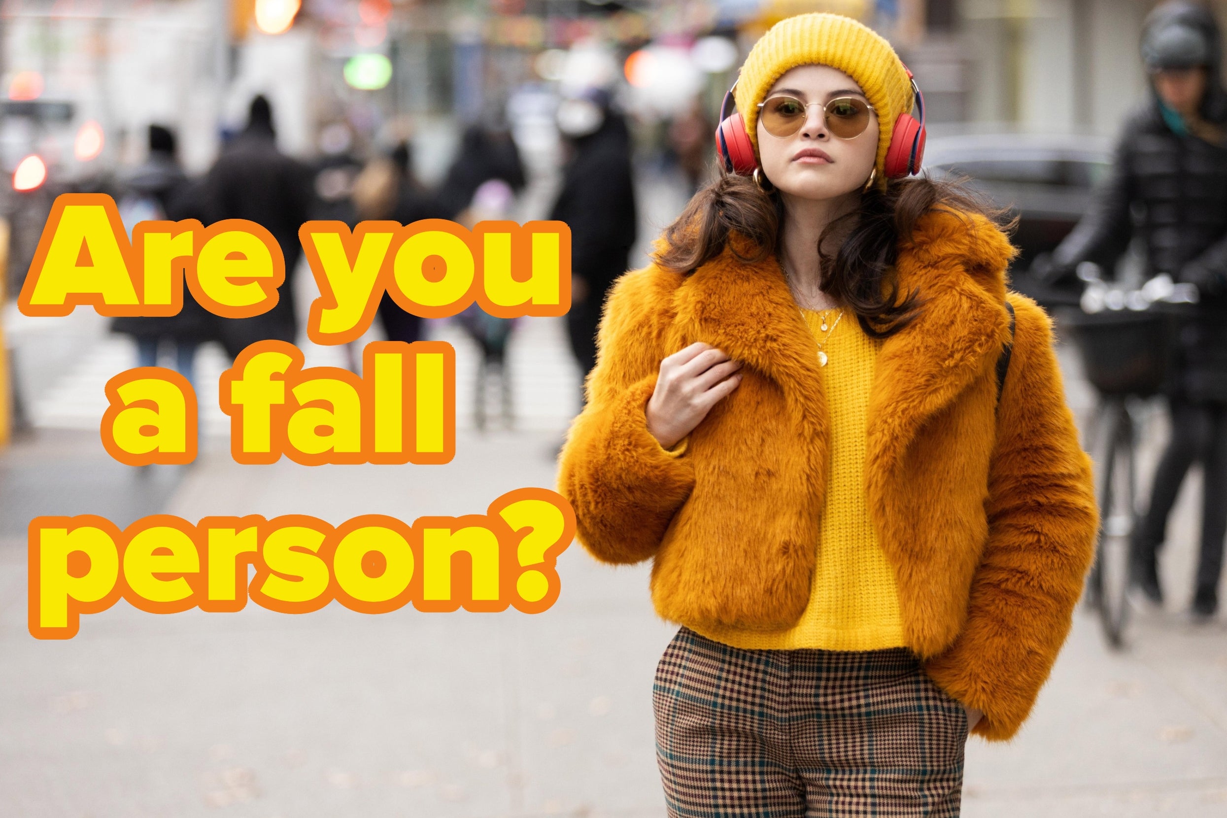 Person in a fur jacket and knit hat walks in a busy city. Text beside them reads, "Are you a fall person?"