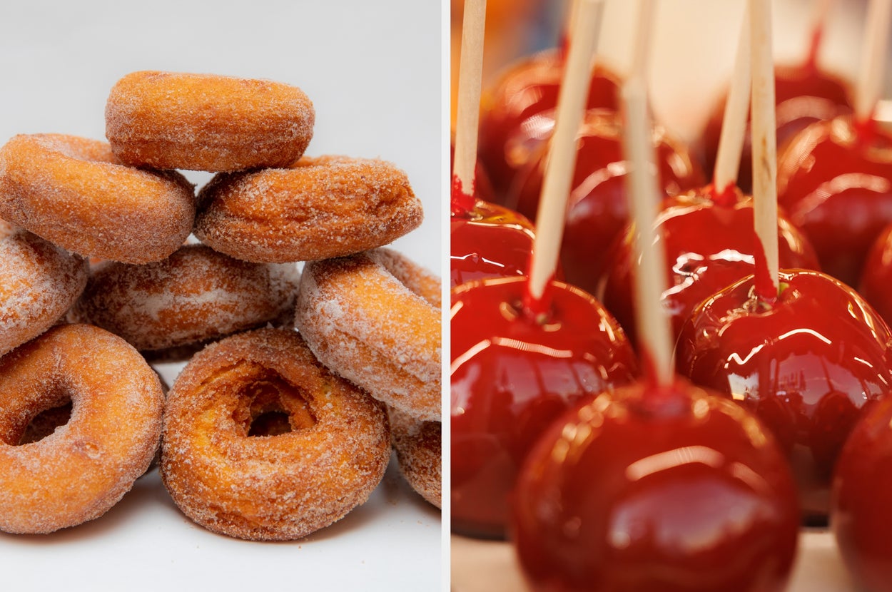 Sugary donuts stacked next to glossy, red candy apples with sticks