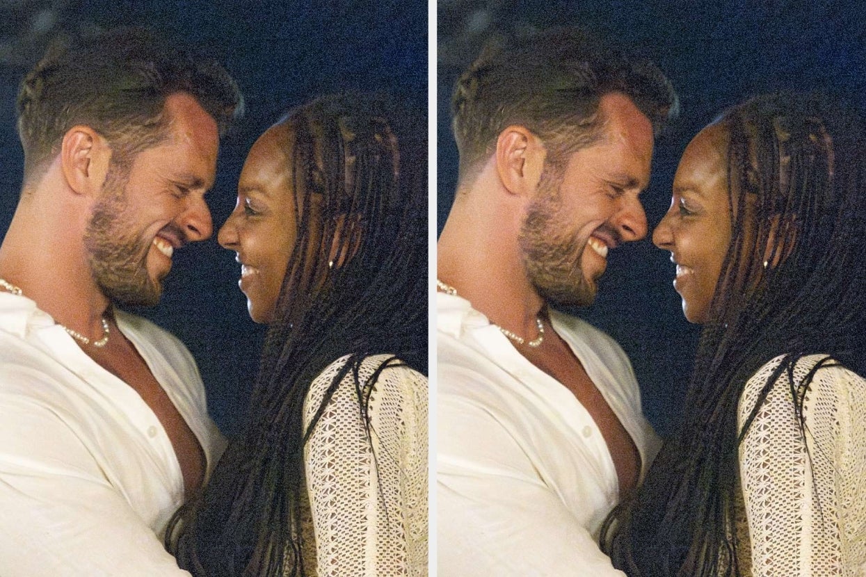 Two people smiling closely, embracing affectionately. Both wear casual, light-colored clothing