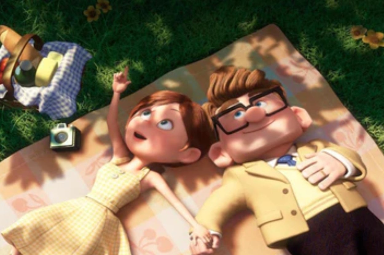 Animated couple from a film lying on a picnic blanket, looking at the sky, surrounded by picnic items