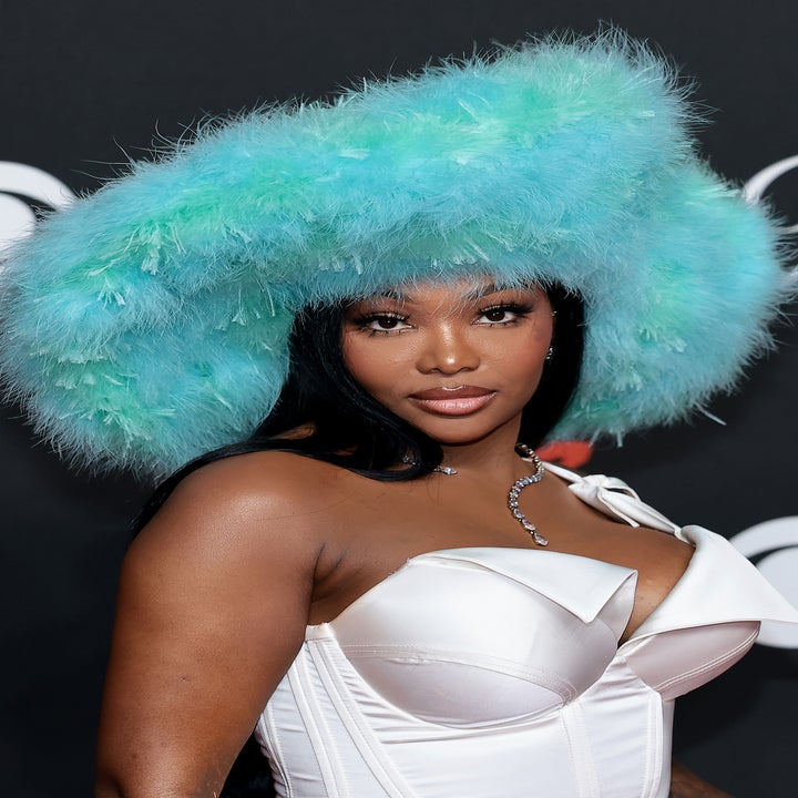 Summer posing in big, fluffy hat