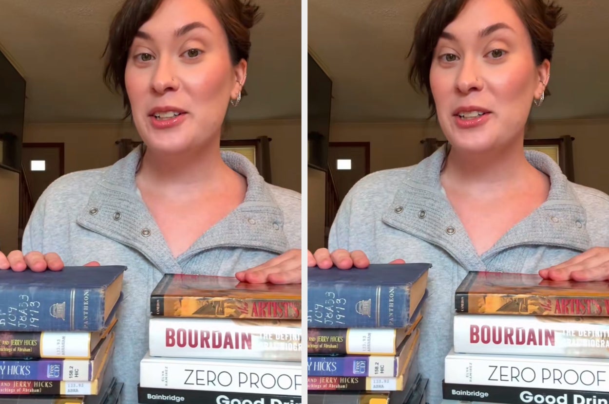 A person presents a stack of books titled for an August curriculum. Titles include works by Jerry Hicks, Bourdain, and others on drinks and snacks