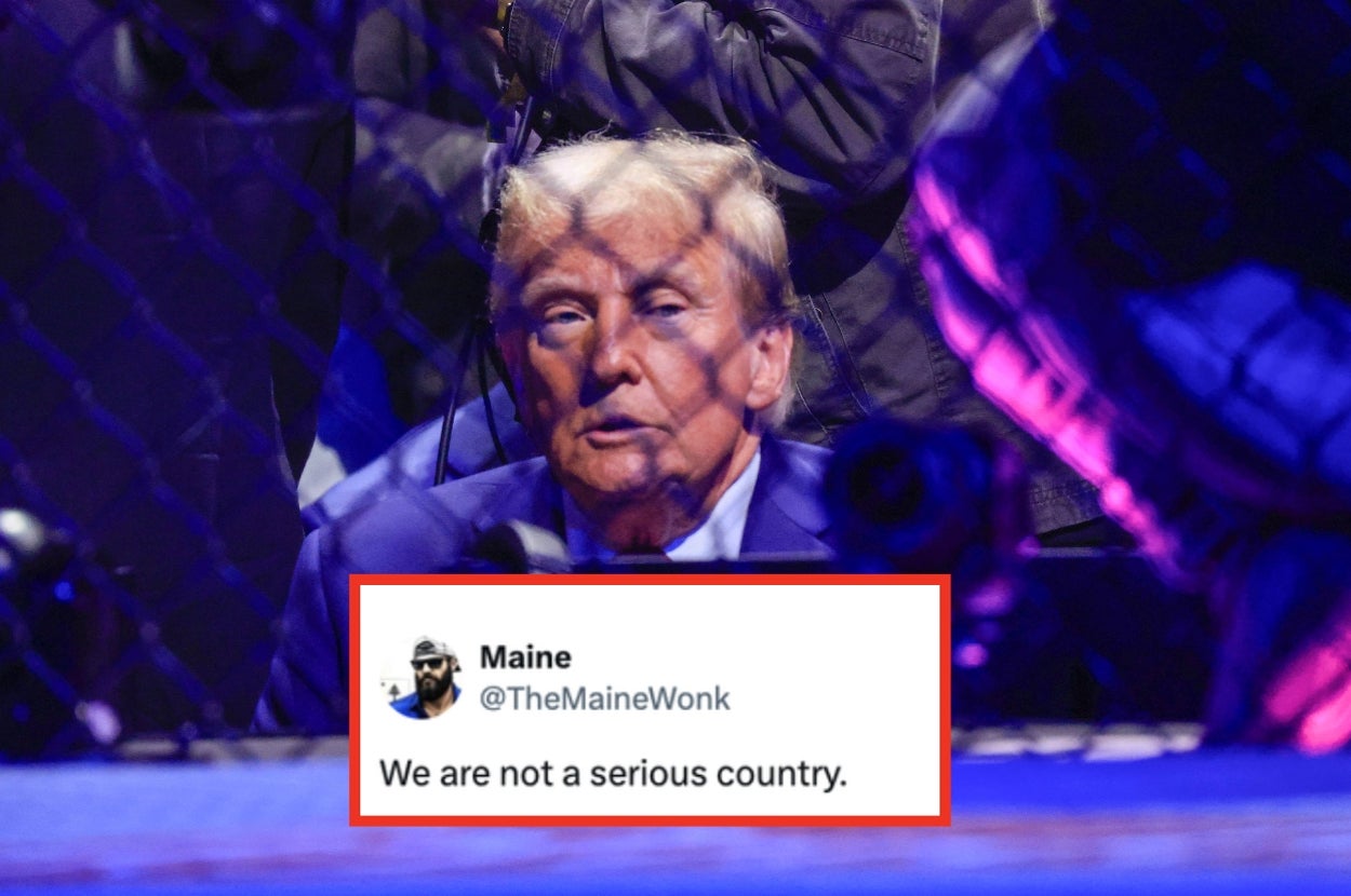 A person sitting behind what appears to be a cage at an event, with a tweet overlayed that reads, "We are not a serious country."