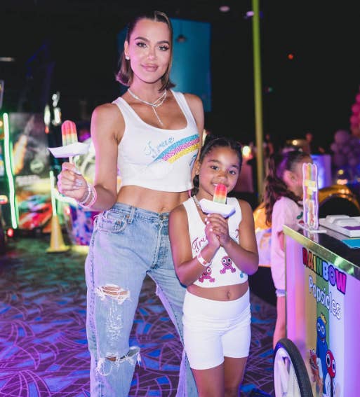 Khloé Kardashian and her girl holding rainbox JonnyPops