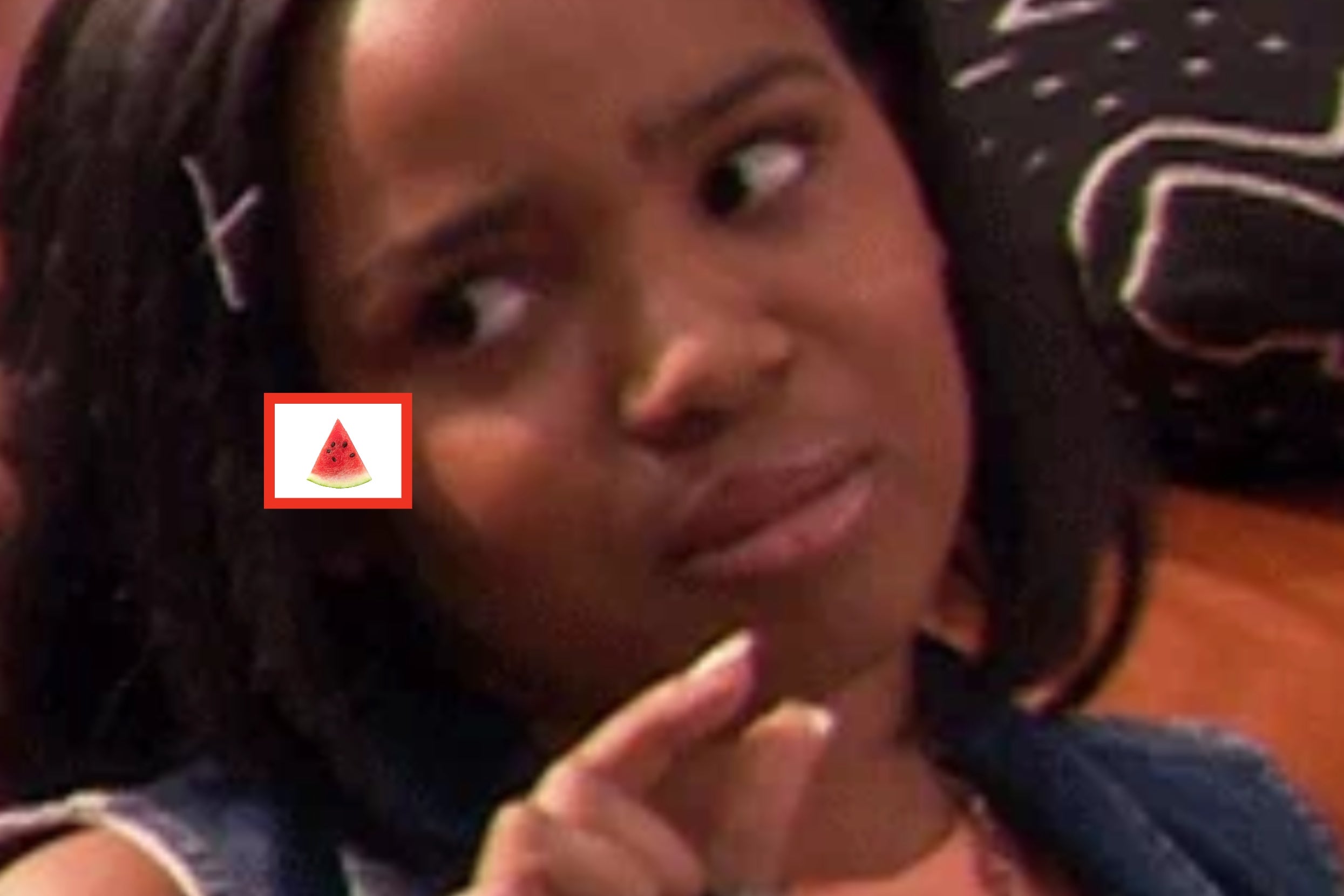 Person making a skeptical face with two fingers held close together, as if indicating something small