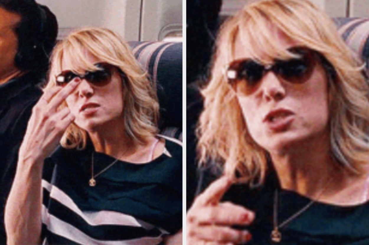 Person with sunglasses and striped top appears animated while gesturing, possibly on a flight. Image has a humorous or candid feel