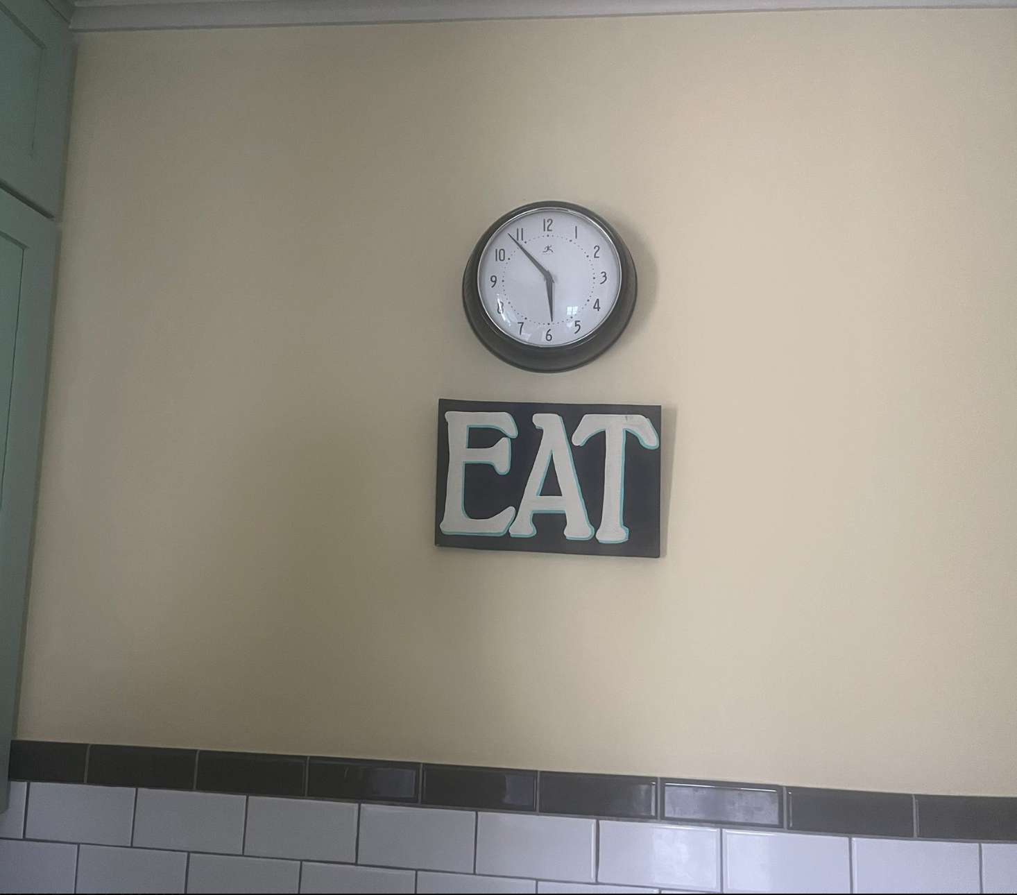 35, positioned supra  a motion   with the connection     "EAT" successful  a room  setting