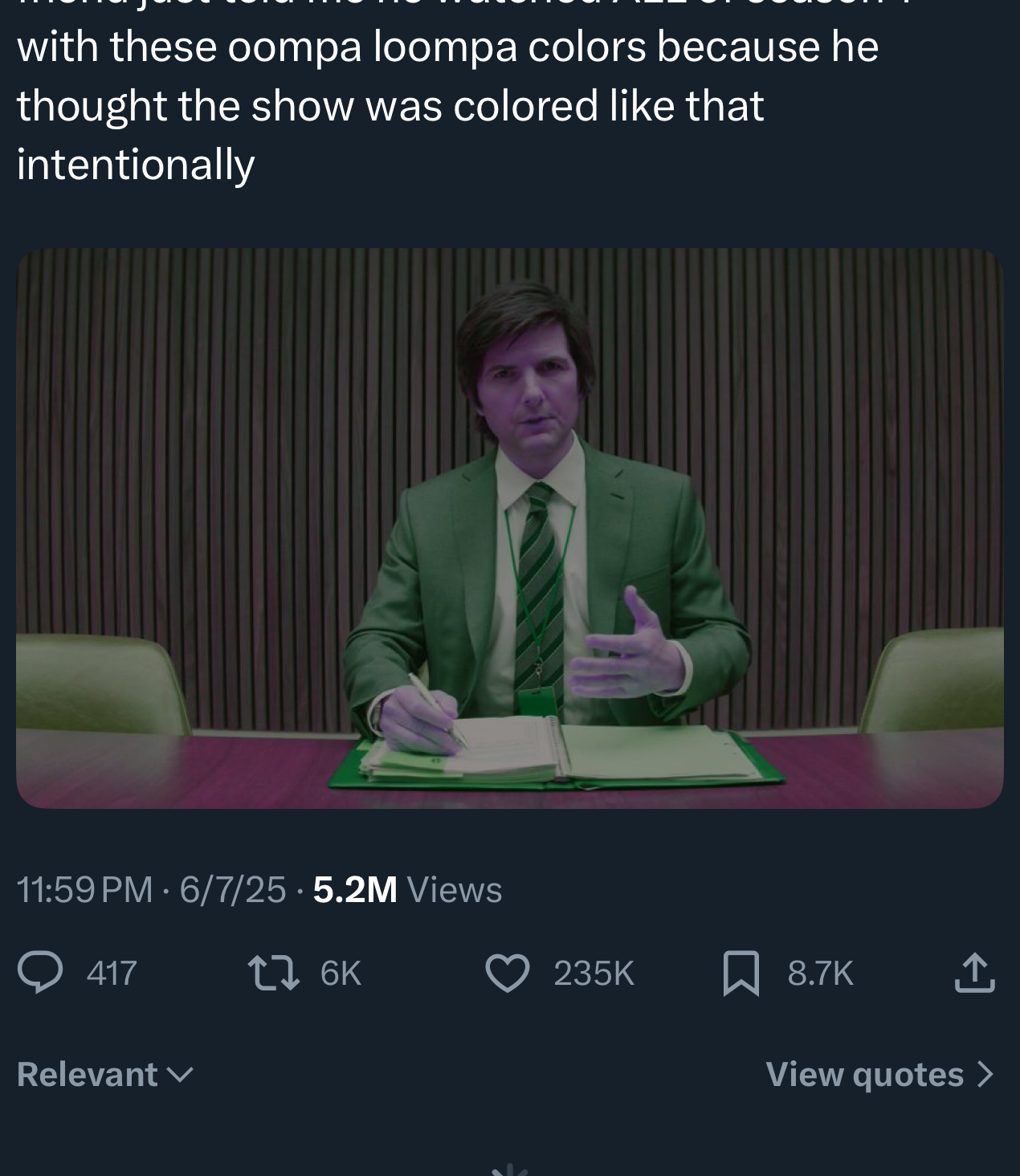 A idiosyncratic   successful  a suit   sits astatine  a table  with papers, believing a show's colors were intentional. Image is portion  of a societal  media station  discussing this amusing mistake