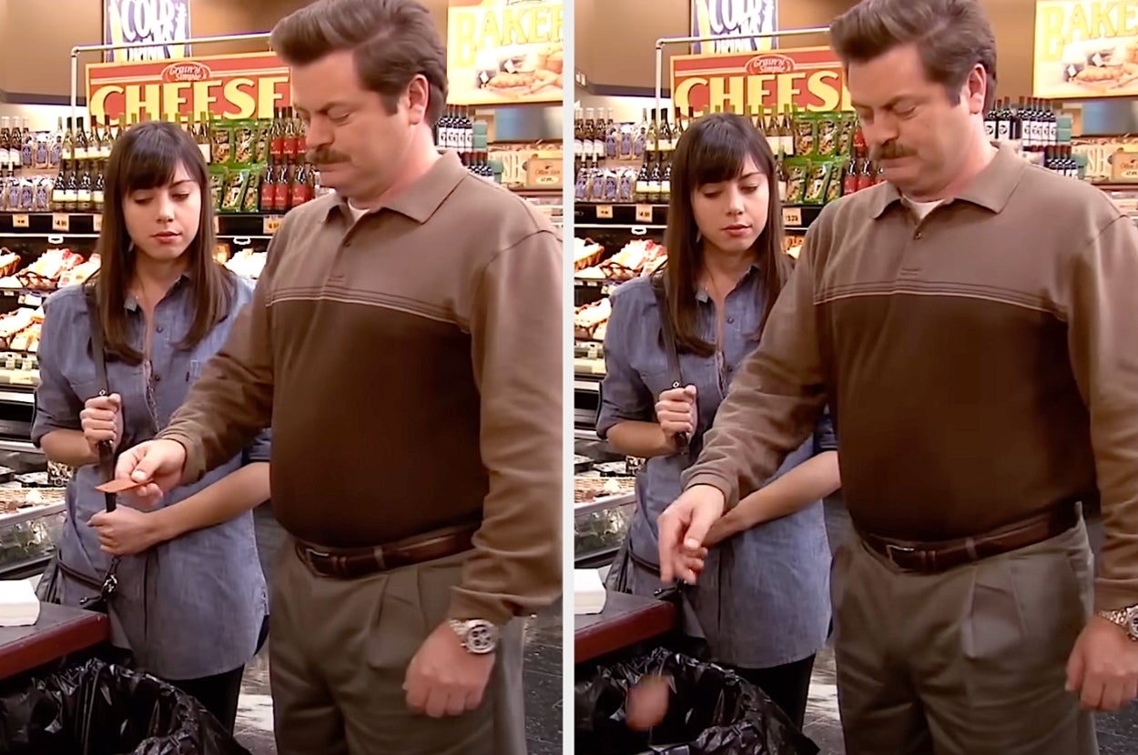 Two people in a grocery store; one drops something in the trash while the other watches. They both appear focused on the task