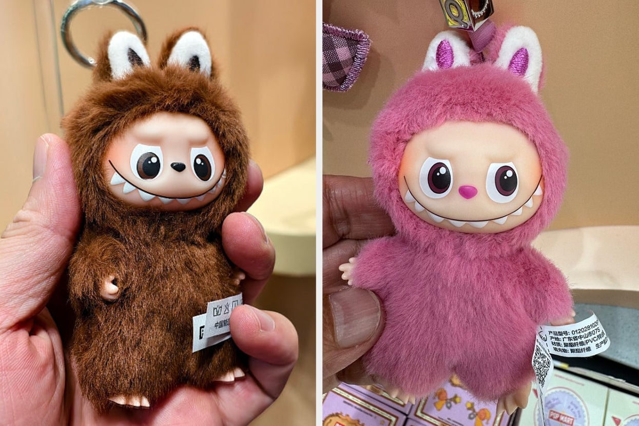 Two stuffed toys with large eyes and sharp teeth, one in a brown furry suit and the other in a pink one, both with bunny ears