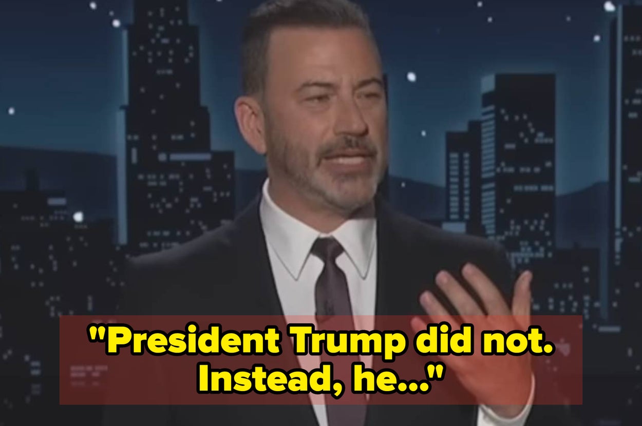 A man in a suit is speaking on a talk show stage, with a quote about President Trump displayed at the bottom