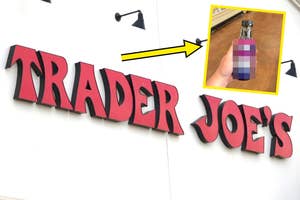 Sign for Trader Joe's store with an inset of a hand holding a blurred bottle