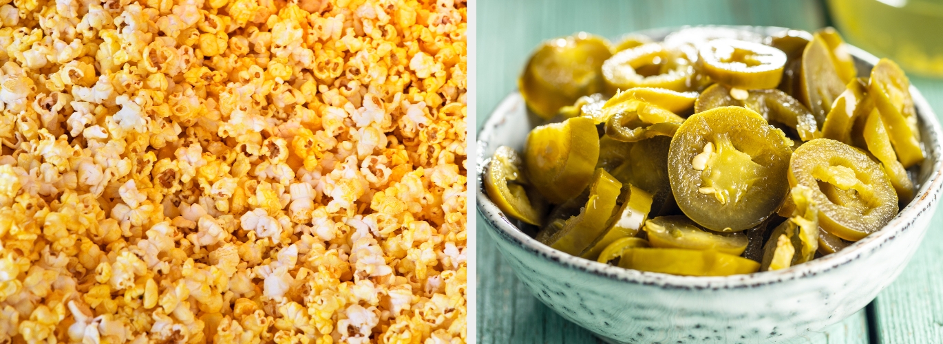 Close-up of buttered popcorn and a bowl of sliced jalapeños