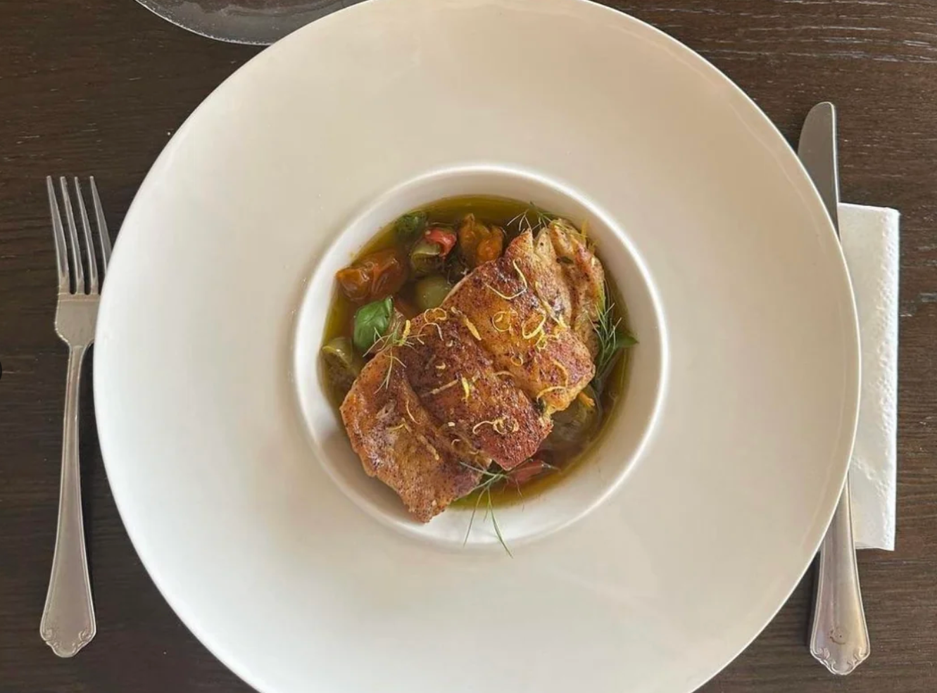 A plate with a cut of meat on top of vegetables is presented, seen on a Reddit page titled "Rate my plating."