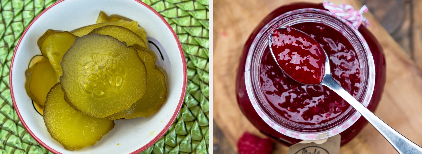 A bowl of sliced pickles next to an open jar of jam with a spoon