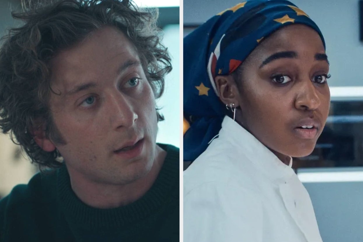 Two people in a TV scene: one with curly hair in casual wear, the other wearing a headscarf and chef's coat, engaged in conversation