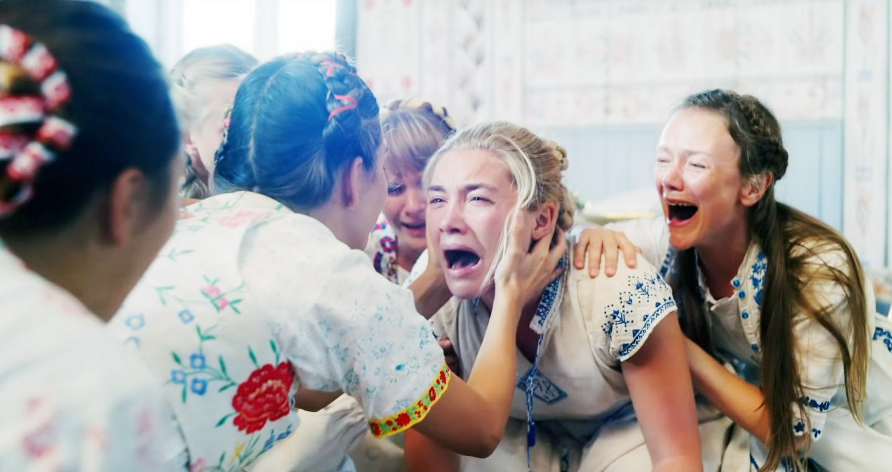 Florence Pugh surrounded by other women in "Midsommar."