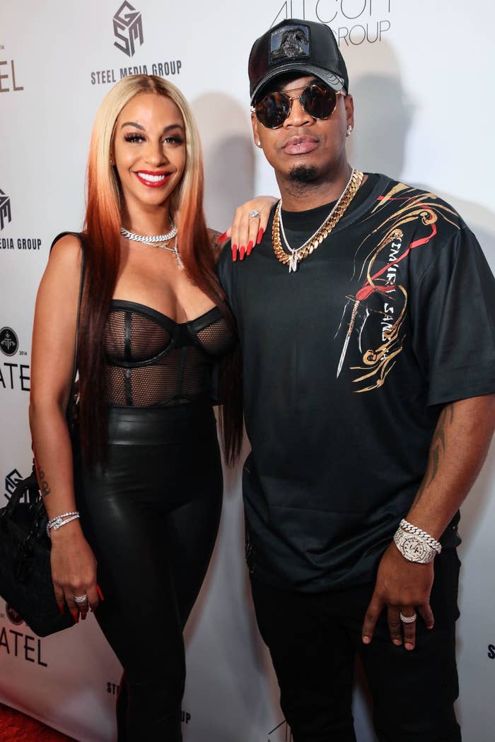 Two radical airs connected a reddish carpet. The pistillate wears a mesh apical and the antheral wears a achromatic garment with golden concatenation details and a cap