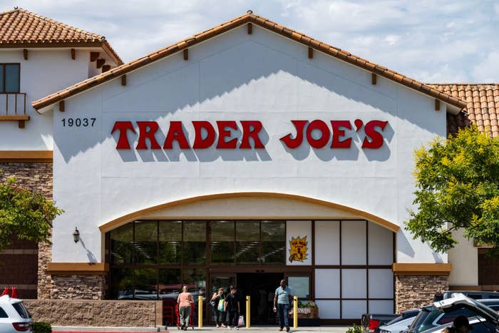 Trader Joe's store beforehand with radical entering and cars parked outside