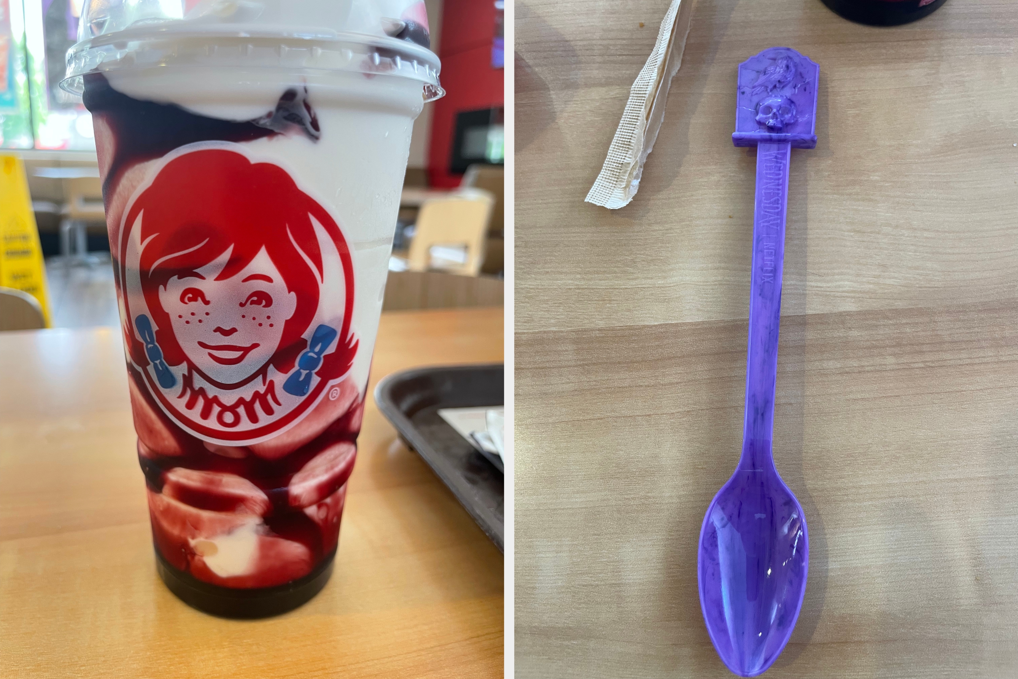 Fast-food restaurant cup featuring Wendy's logo, filled with a creamy beverage topped with a berry sauce