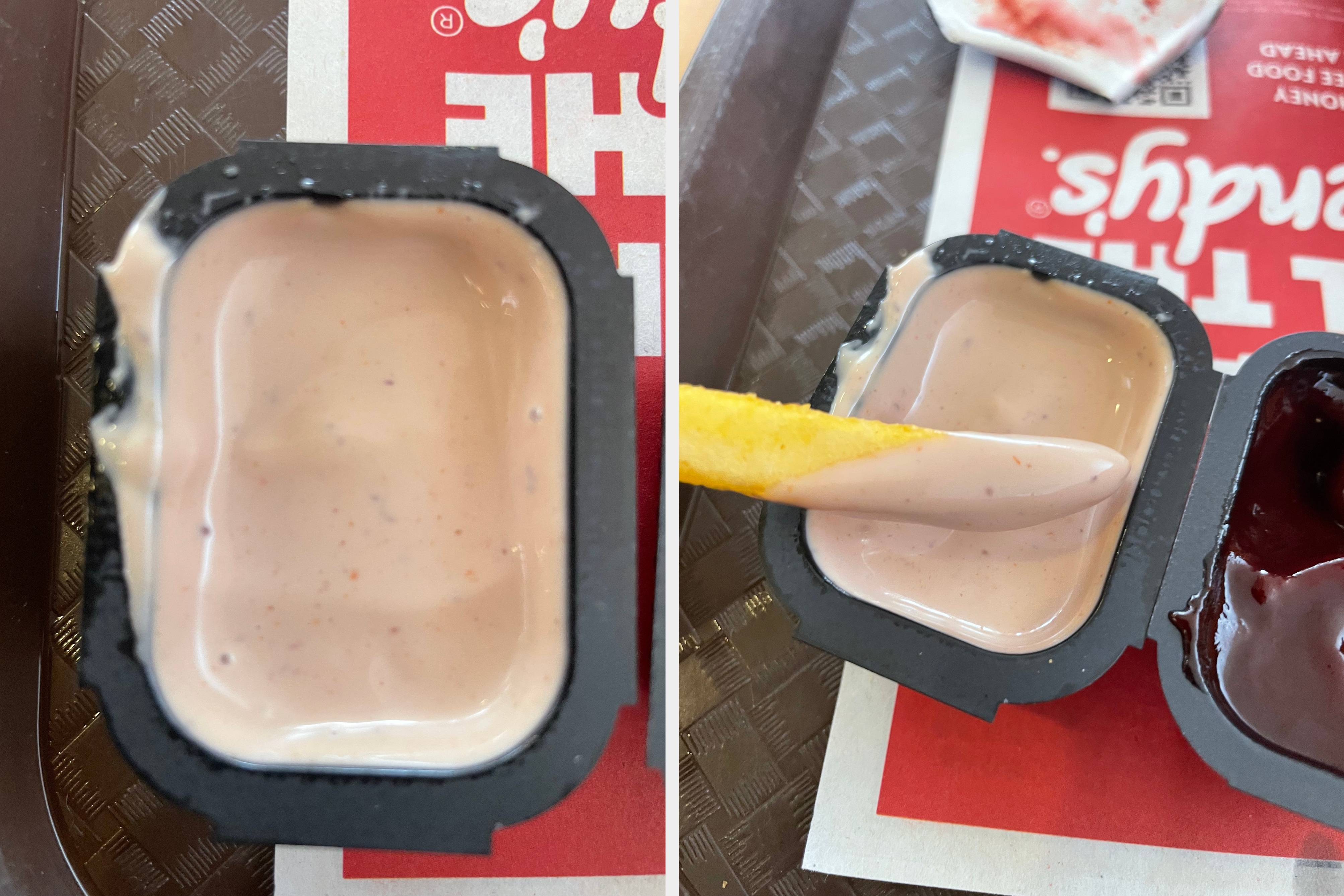 Open sauce container with light creamy dipping sauce on a tray