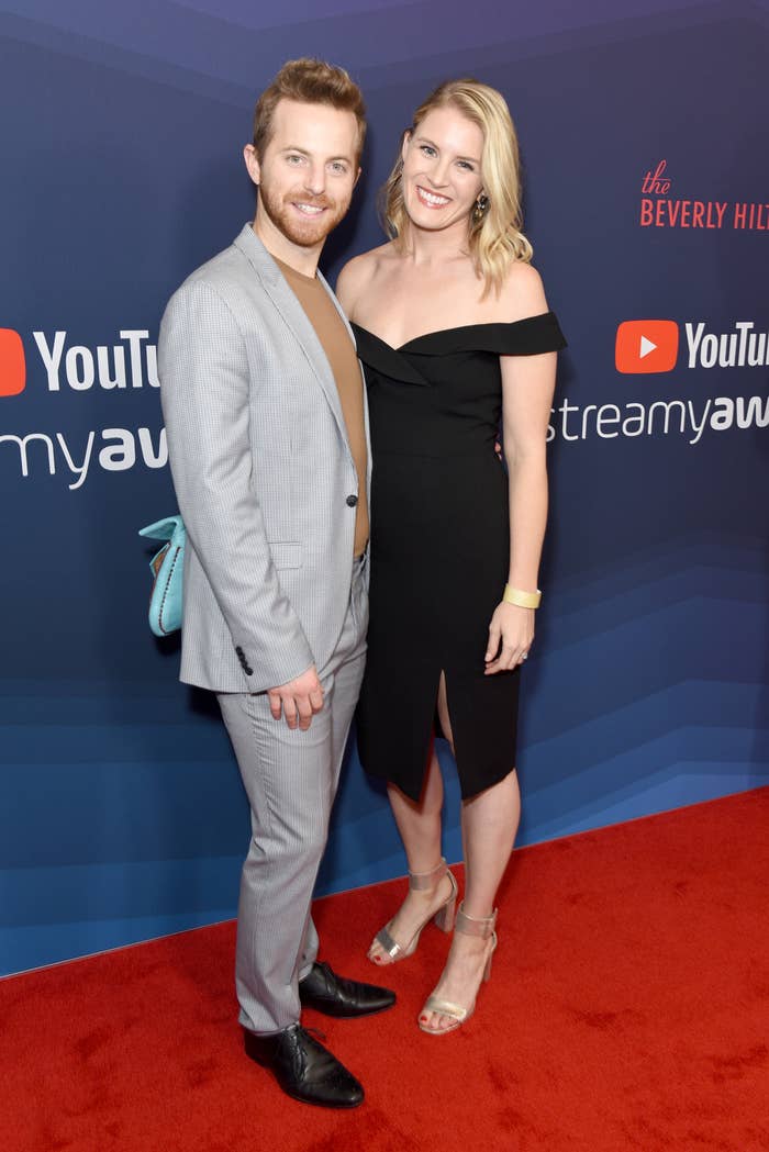 Ned Fulmer and Ariel Fulmer airs connected the reddish carpet. The antheral wears a checked suit and the pistillate wears an off-shoulder achromatic formal with heels