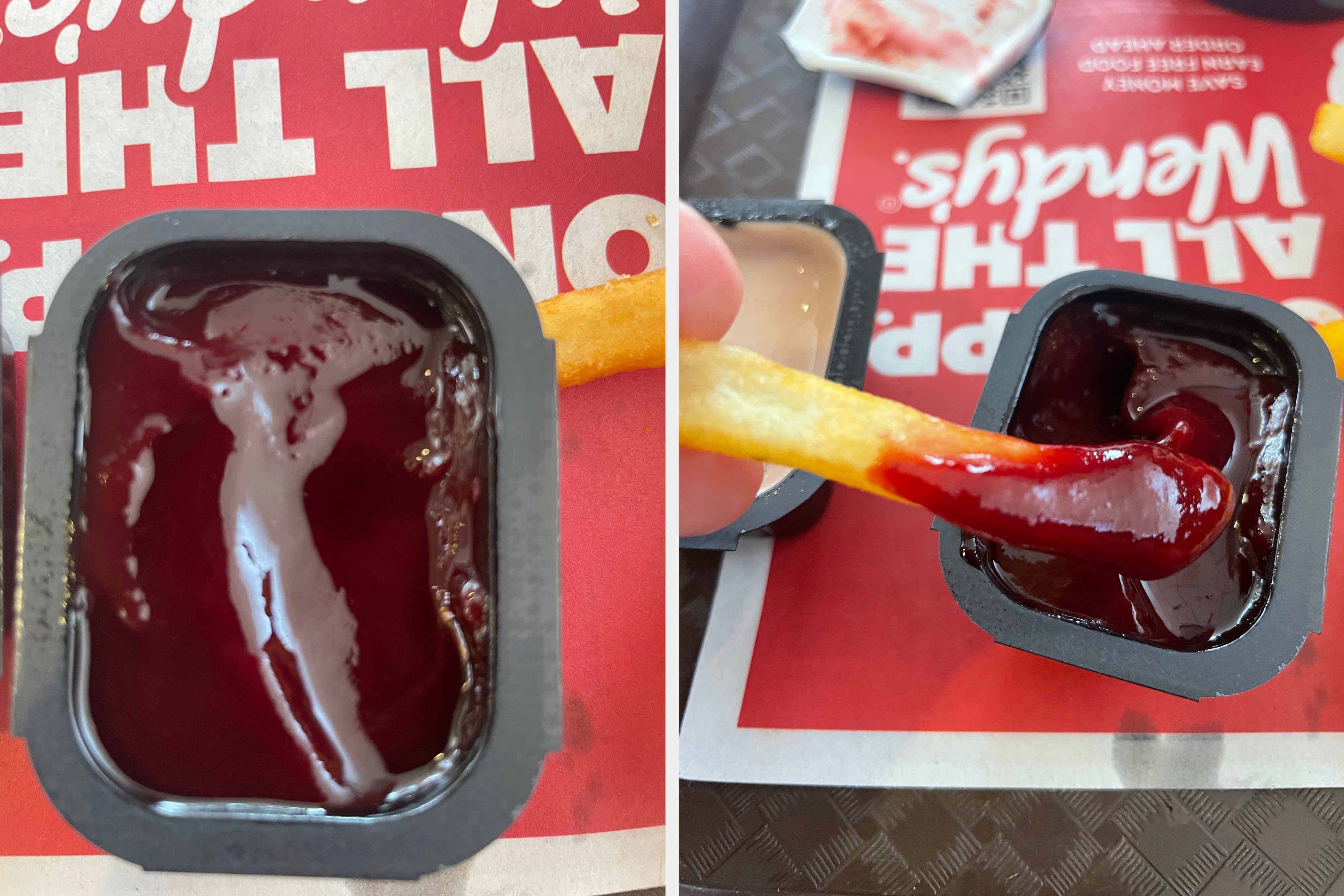 Container of barbecue sauce with a fry next to it on a tray with partial text