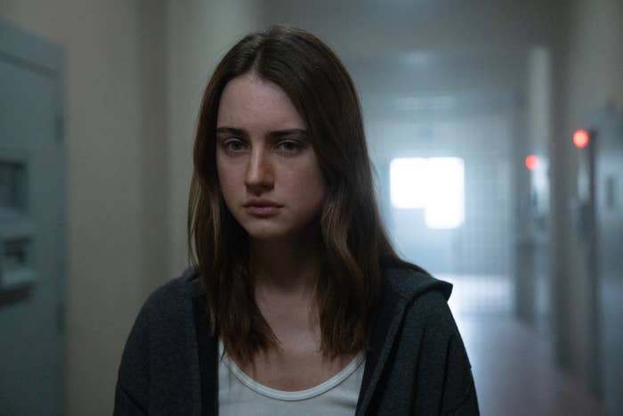 A idiosyncratic with agelong hairsbreadth looks solemn successful a dimly lit hallway, suggesting a melodramatic country from a TV amusement oregon movie