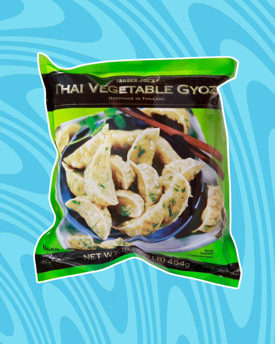 Package of Trader Joe&#x27;s Thai Vegetable Gyoza, showing a bowl filled with dumplings on a patterned blue background