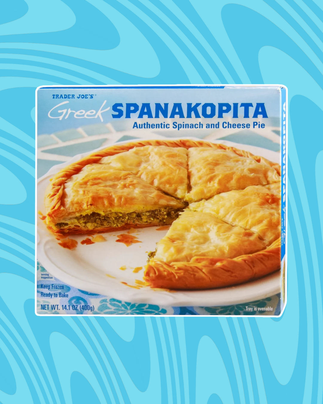 Trader Joe&#x27;s Greek Spanakopita packaging featuring a spinach and cheese pie, shown sliced to reveal its filling
