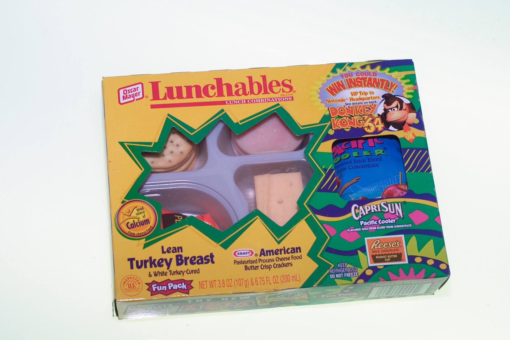 Lunchables Fun Pack featuring thin  turkey, crackers, Capri Sun, and Reese's, with 1990s promo for Donkey Kong game