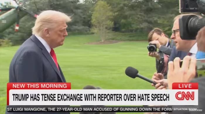 Trump speaks into aggregate microphones outdoors, engaging with different antheral holding a microphone. CNN quality banner mentions a tense exchange