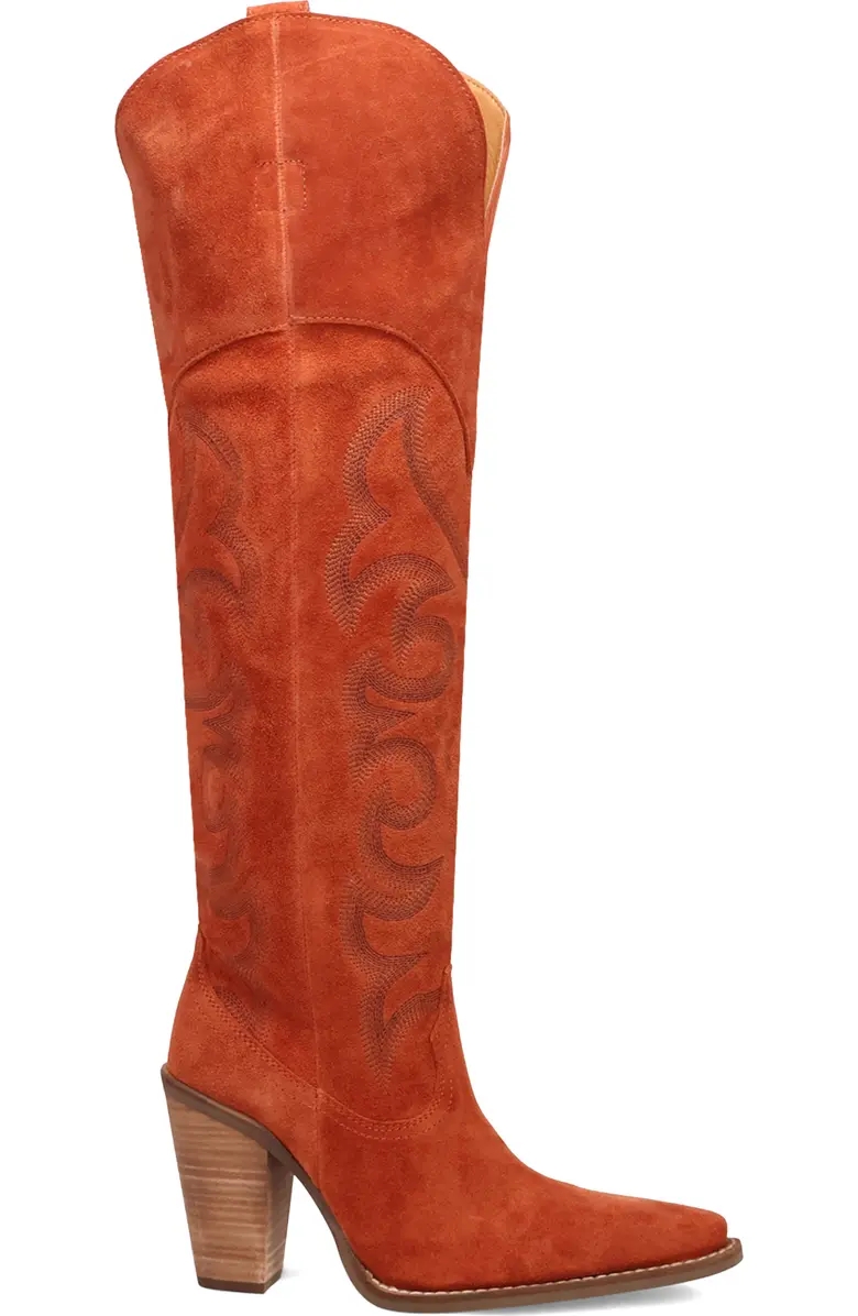 High-heeled suede cowboy boot with intricate stitching, featuring a pointed toe and wooden block heel, suitable for a stylish, western look