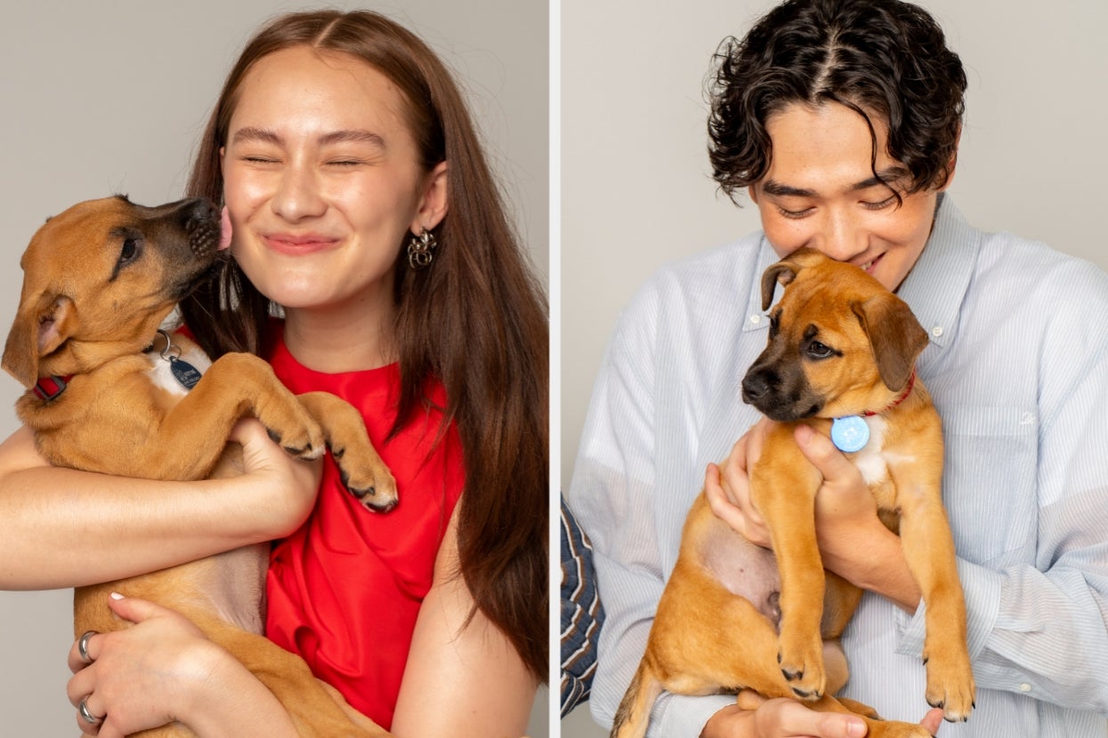 Lola Tung and Sean Kaufman playing with puppies and smiling