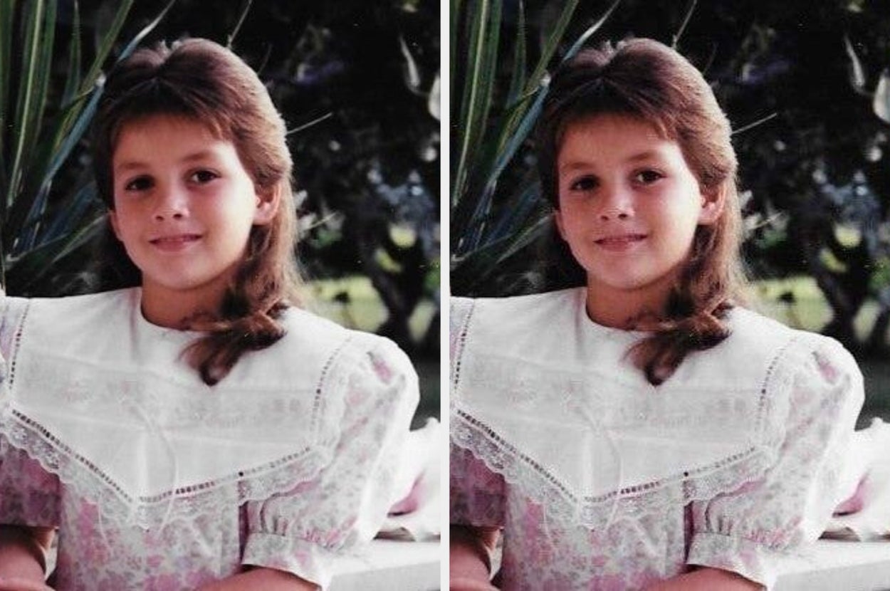 Young child smiling in a garden, wearing a lace-collared dress with puffed sleeves